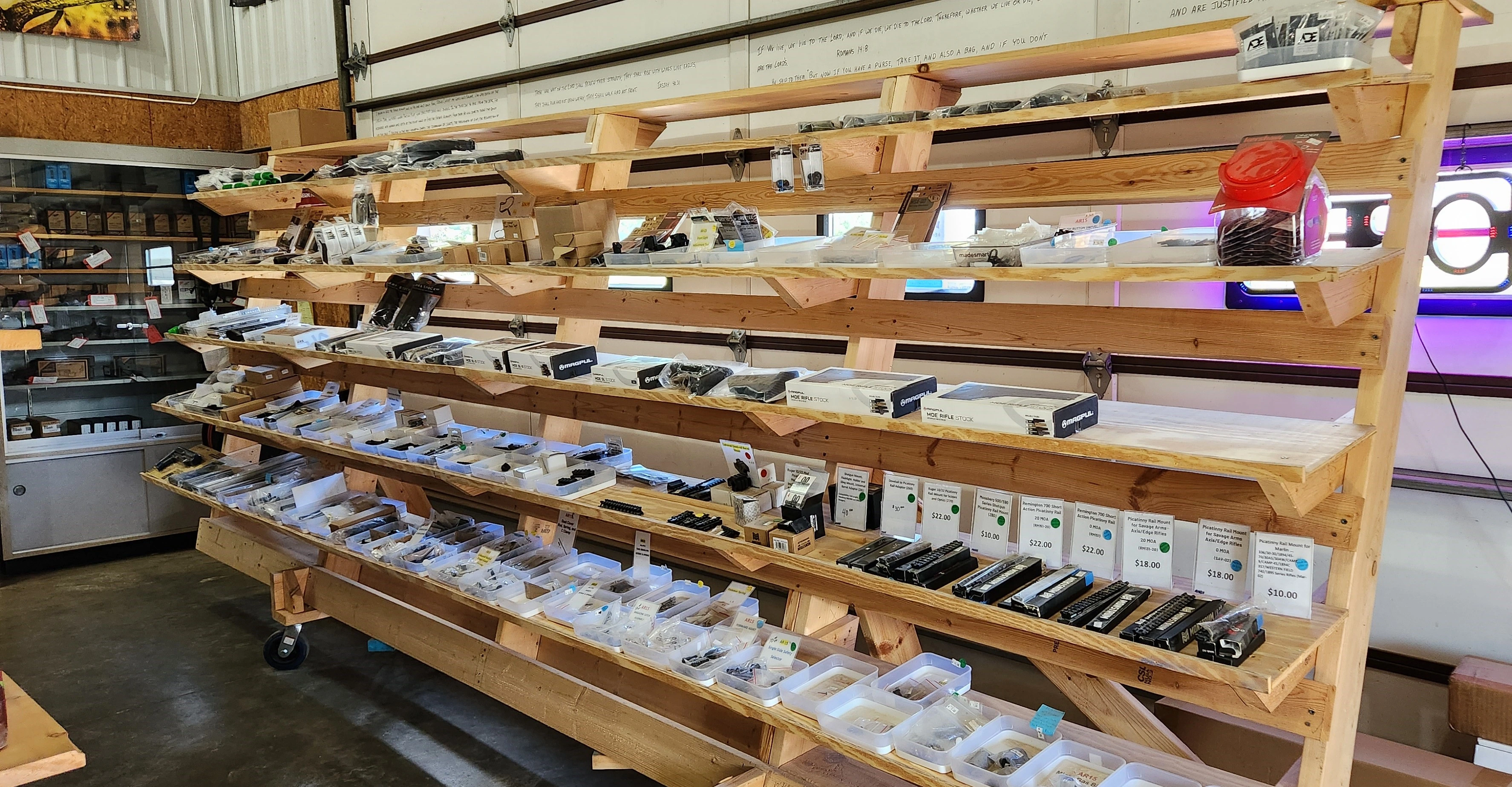 Assorted ammunition and firearm accessories displayed on shelves in Crosshairs Armament LLC.