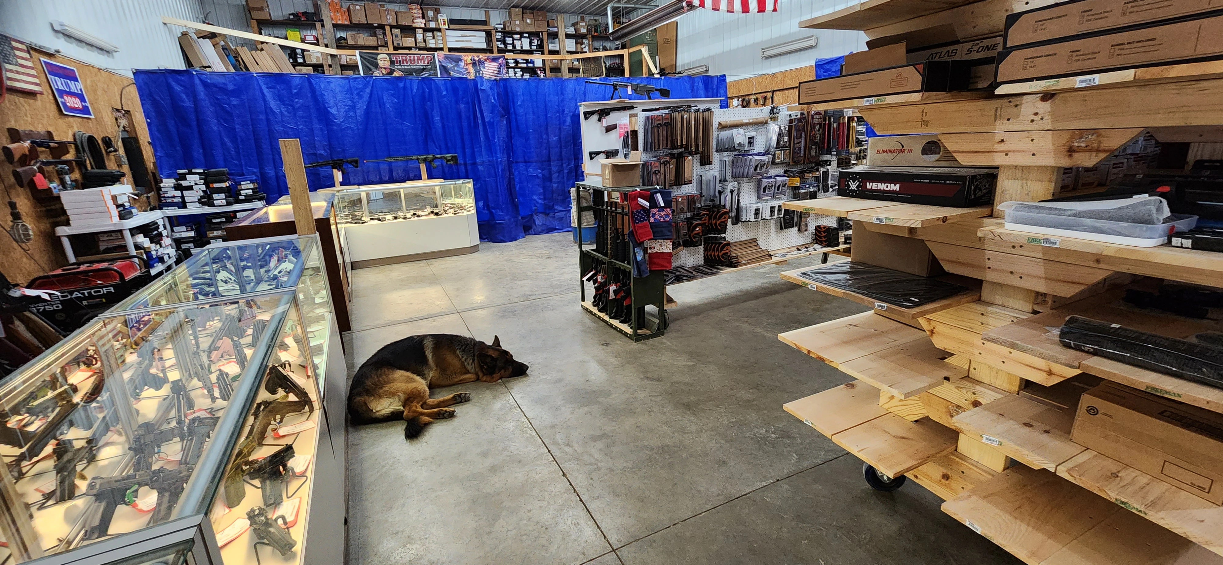 Wideview of shelves and good dogs in Crosshairs Armament LLC.